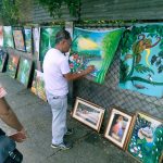 Ilonggo painter sells artwork on street to raise funds for wife's dialysis