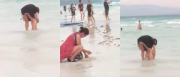 Chinese tourist let her child poops on Boracay shore