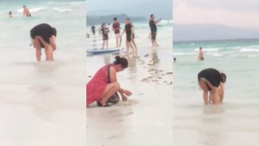 Chinese tourist let her child poops on Boracay shore