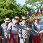Spanish General Leopoldo Peña surrenders his saber to a Filipino revolutionary
