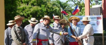 Spanish General Leopoldo Peña surrenders his saber to a Filipino revolutionary