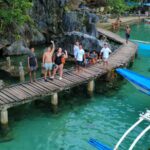 Local and foreign tourists cool off in the clear waters of Kayangan Lake in Coron, Palawan.