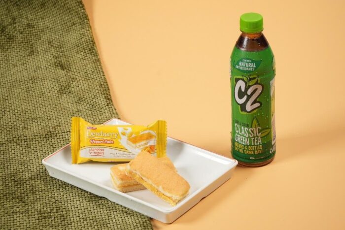 Indulge in the exciting tropical flavor of Dewberry Yogurt Cake Mangoes ‘n Yogurt with a refreshing bottle of C2 Green Tea.