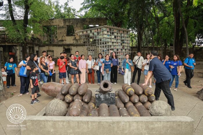 Overseas Filipino Workers (OFWs), returning migrant workers, and their loved ones tour around two of the iconic heritage sites in Intramuros — the Centro de Turismo Intramuros and Fort Santiago — during the opening day of Pasyal Pamilya on Monday (May 25).